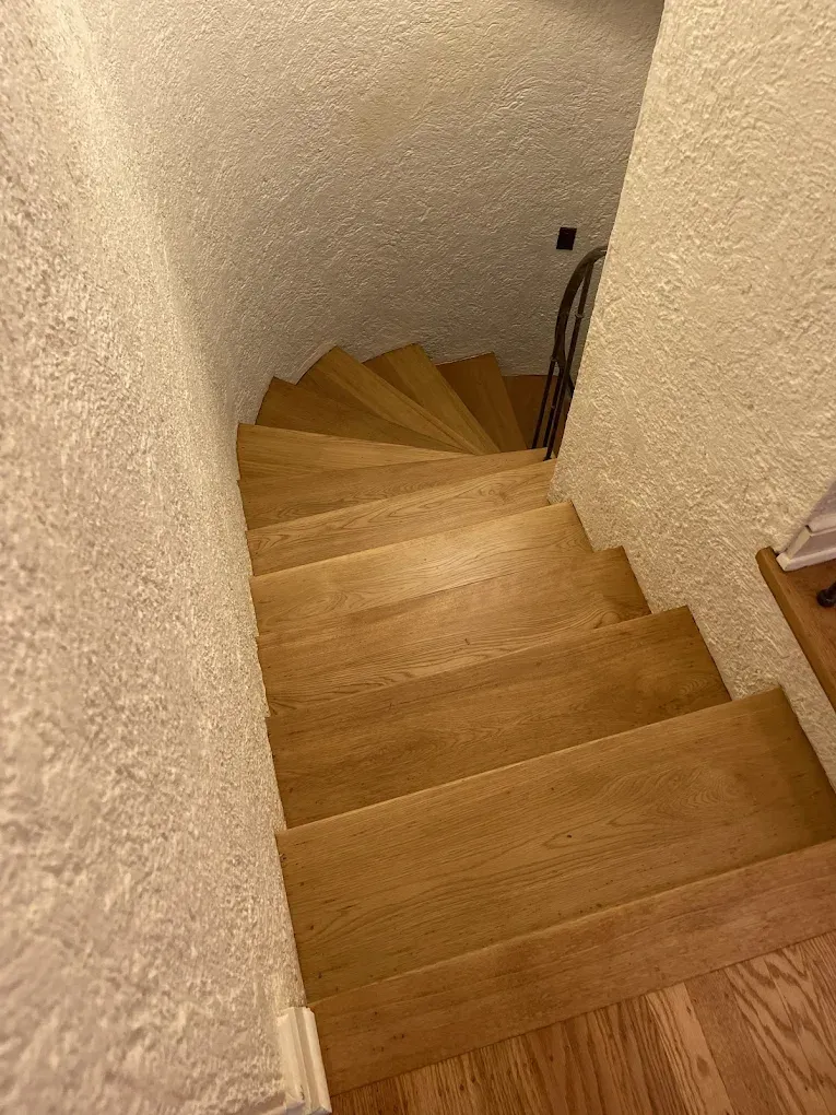 A wooden staircase leading up to the second floor of a house.