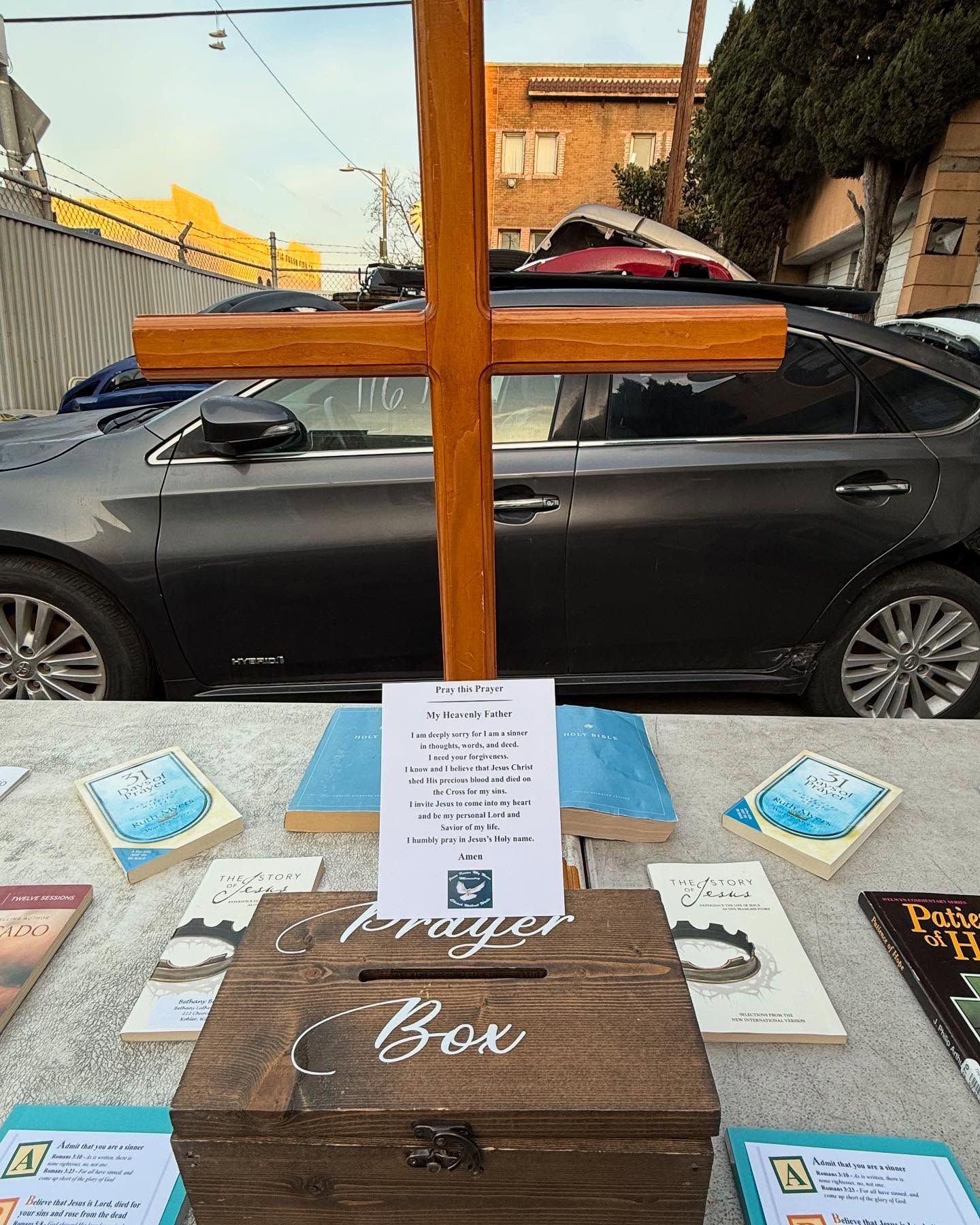 A wooden cross stands above a 