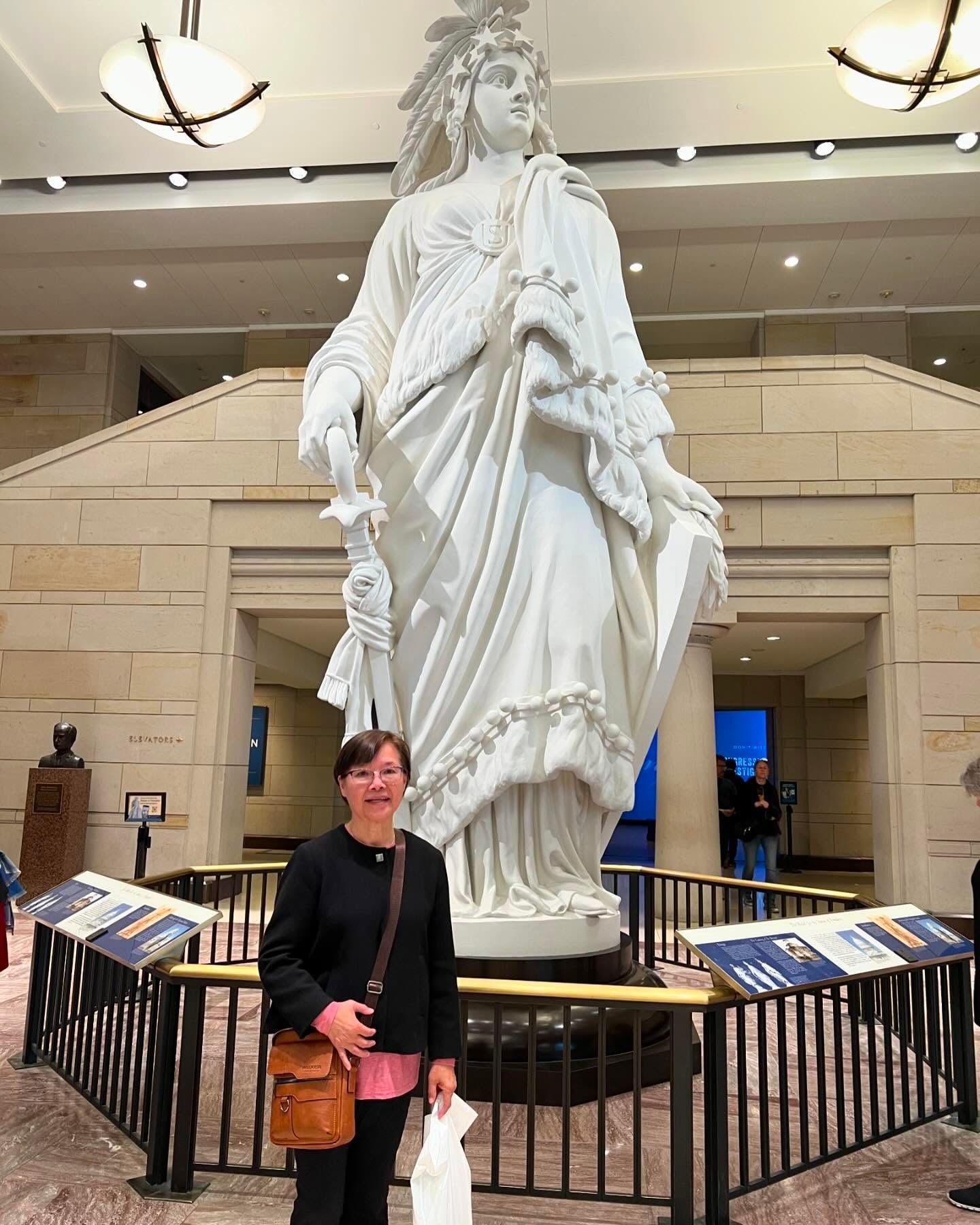 A person standing in front of the large 