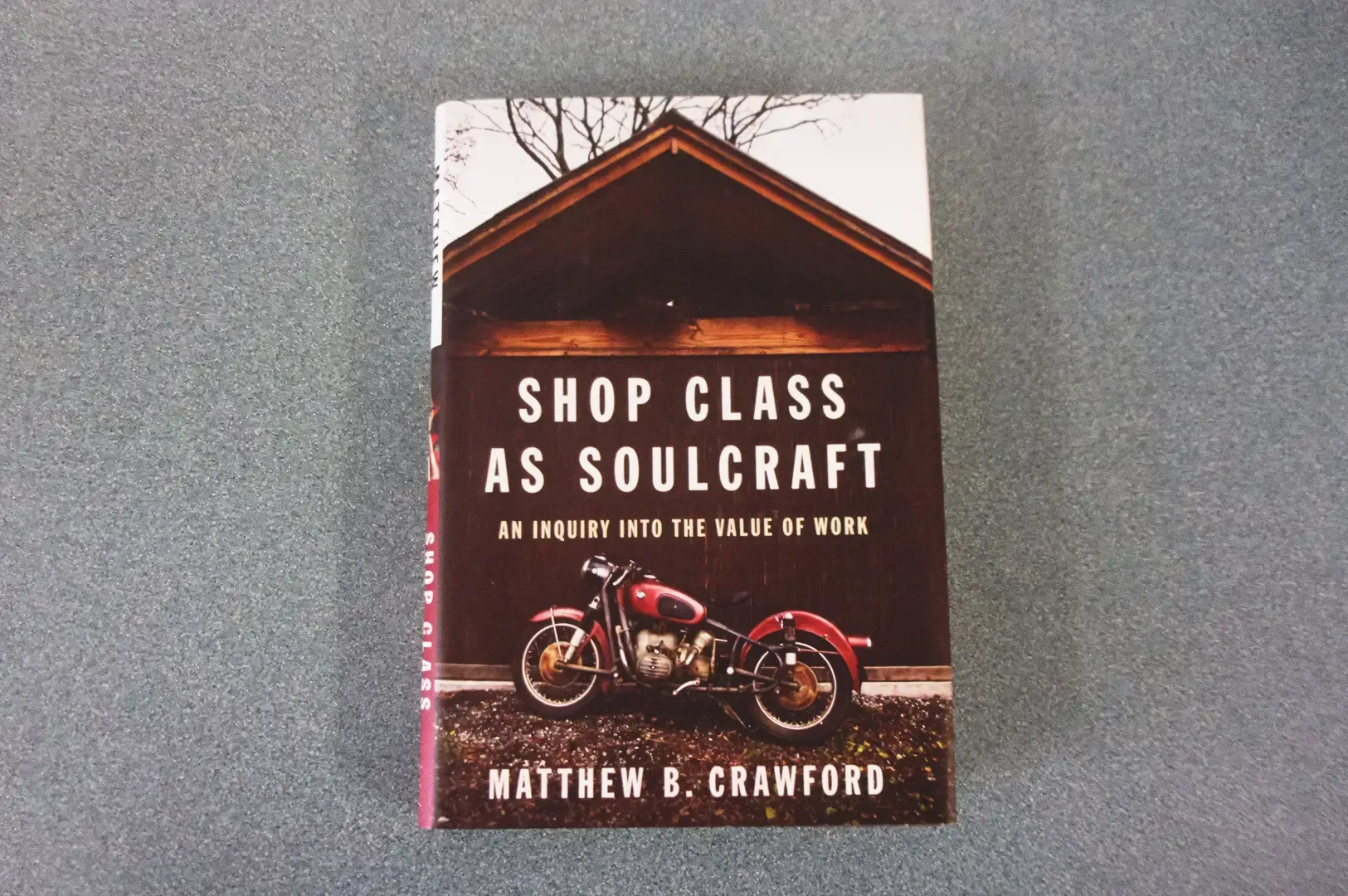 Overhead top‑down shot of the book Shop Class as Soulcraft: An Inquiry into the Value of Work by Mat