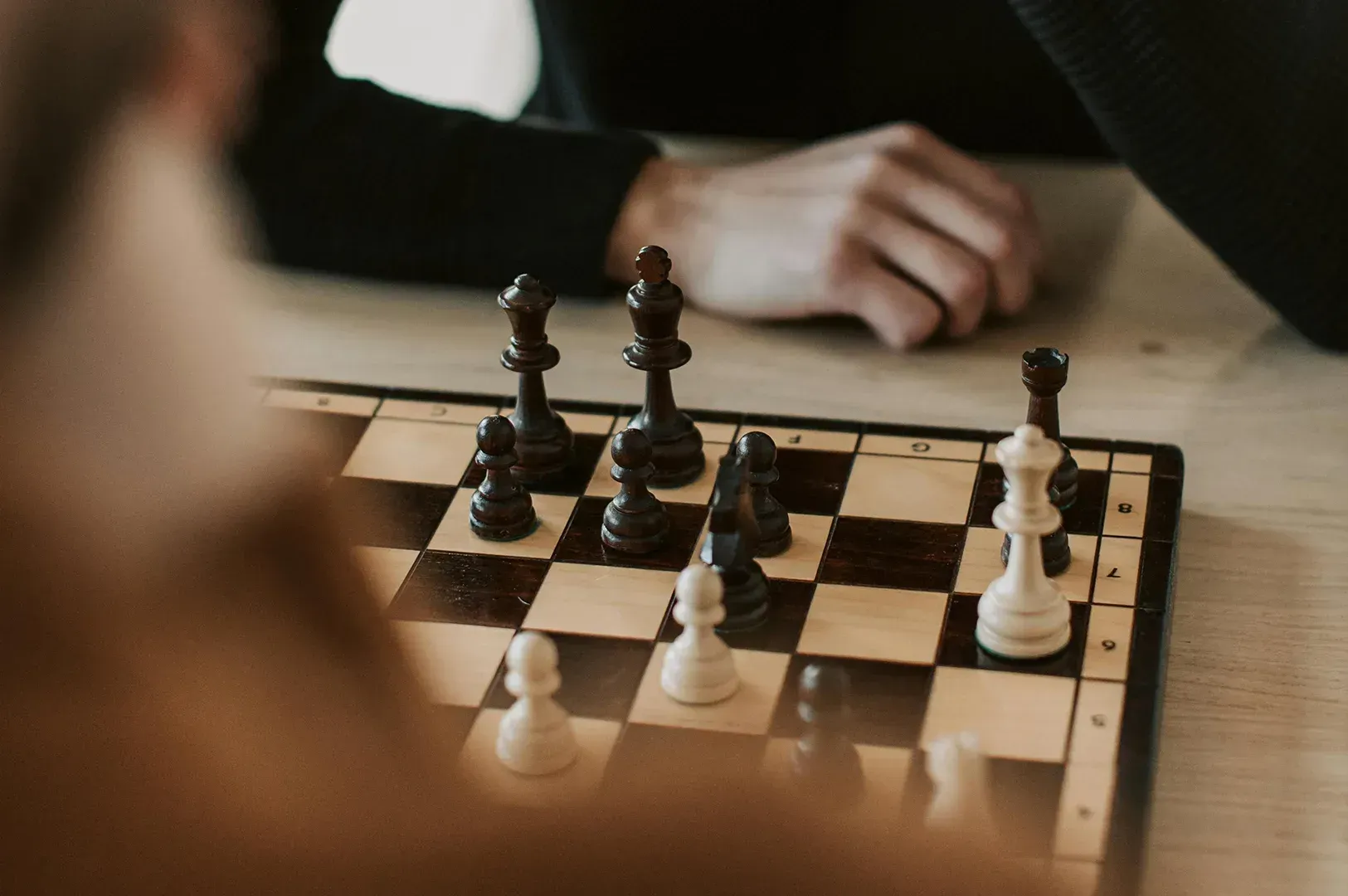 A close-up of a chess game symbolizing strategic decision-making, speed, and precision in leadership, inspired by L. David Marquet’s