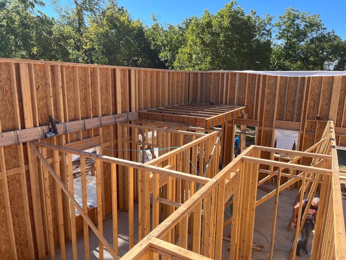 A house is being built with a lot of wooden beams.