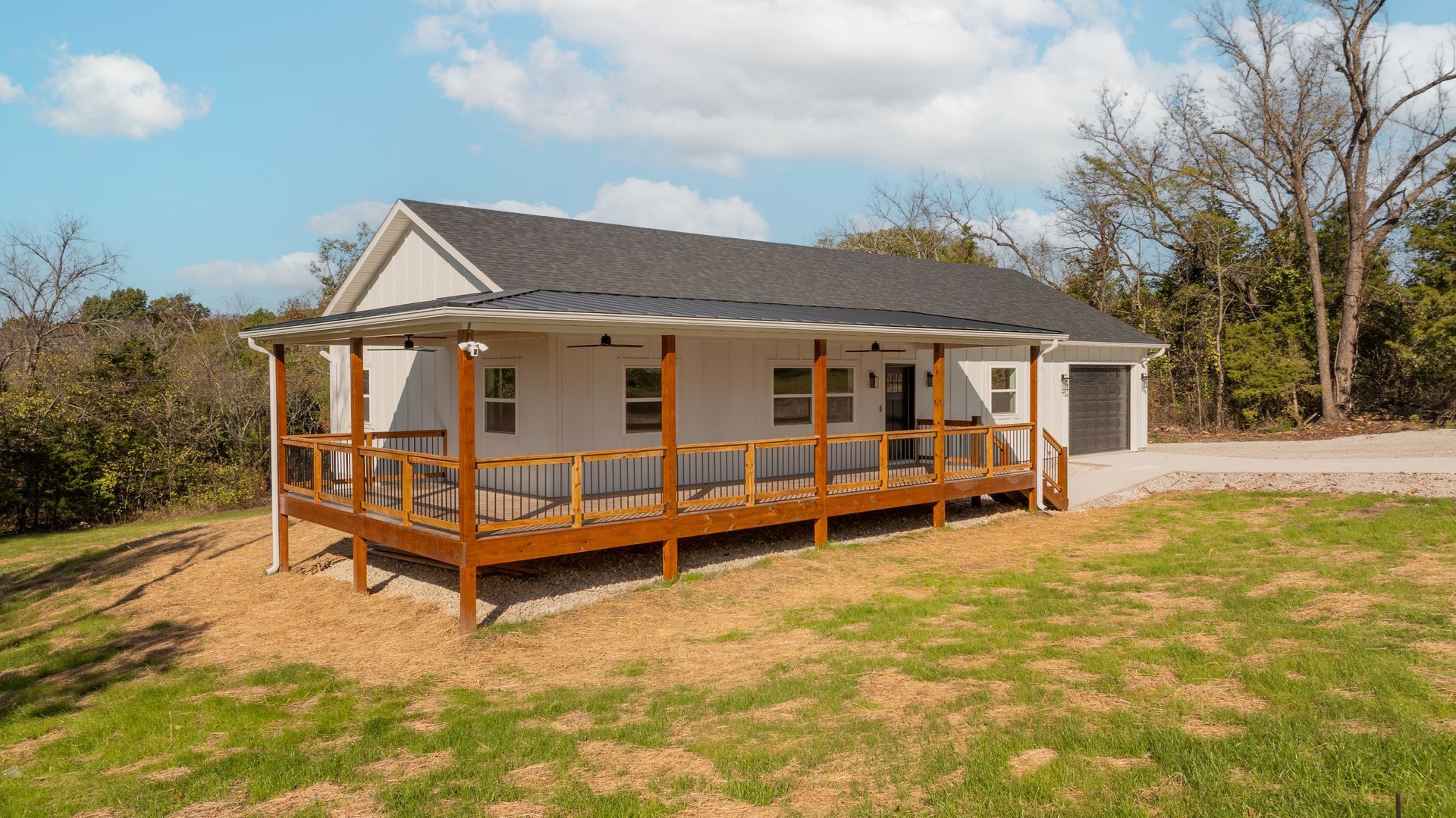 A house is being built in the middle of a dirt field.