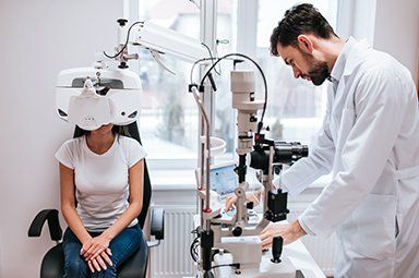 Optometry — Doctor Checking Patient's Eye in Chicago, IL