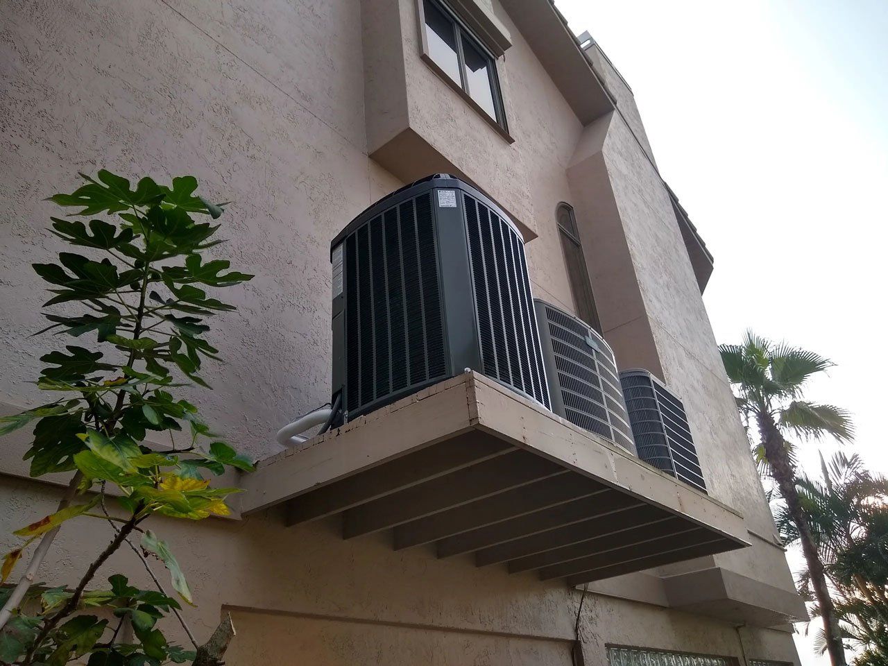 A building with an air conditioner on the side of it