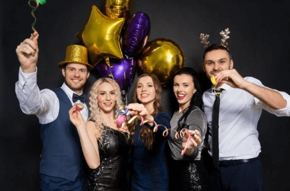 People using a photo booth at a New Years Eve Party