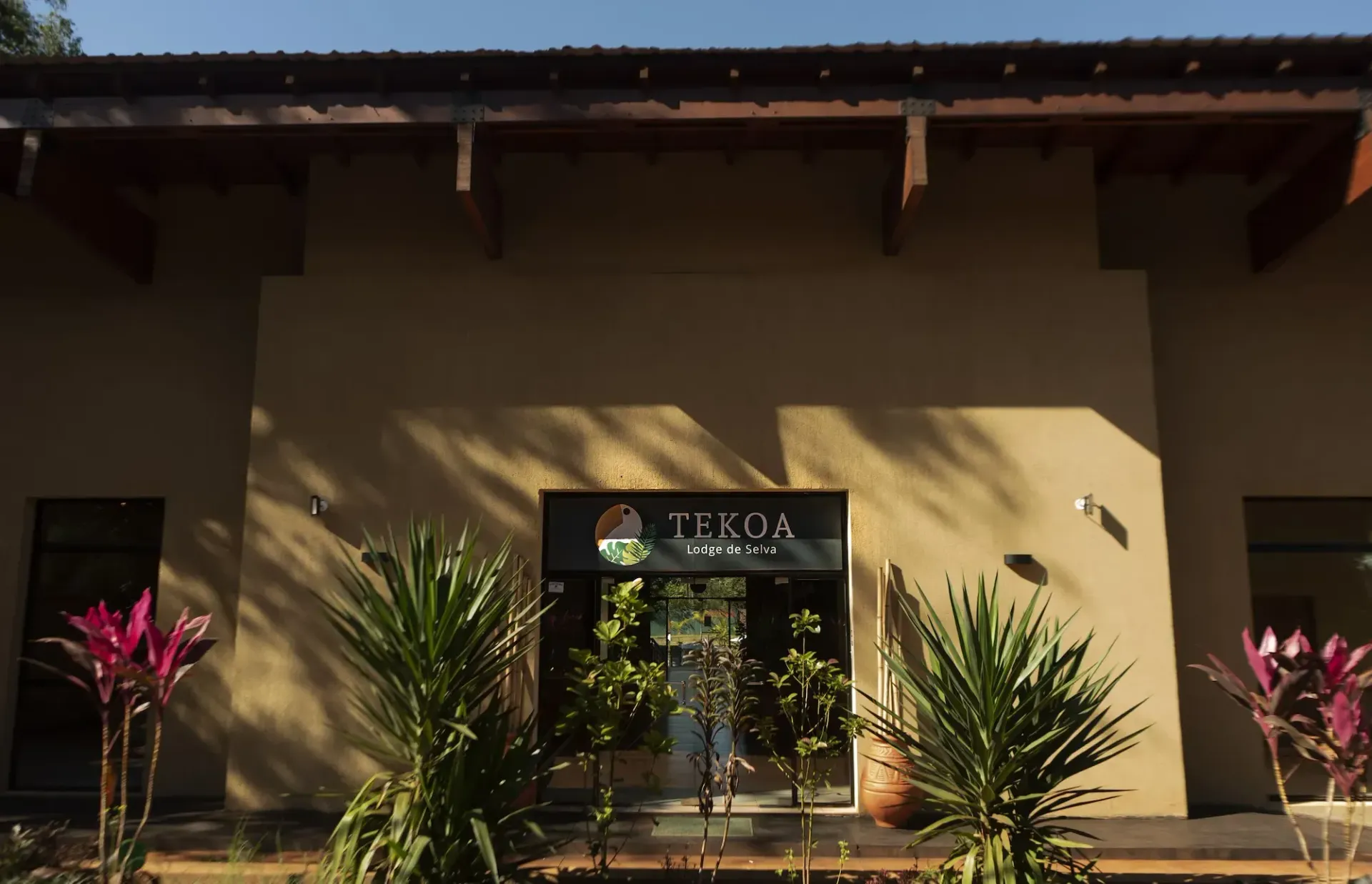 A building with a sign that says tekoa on it