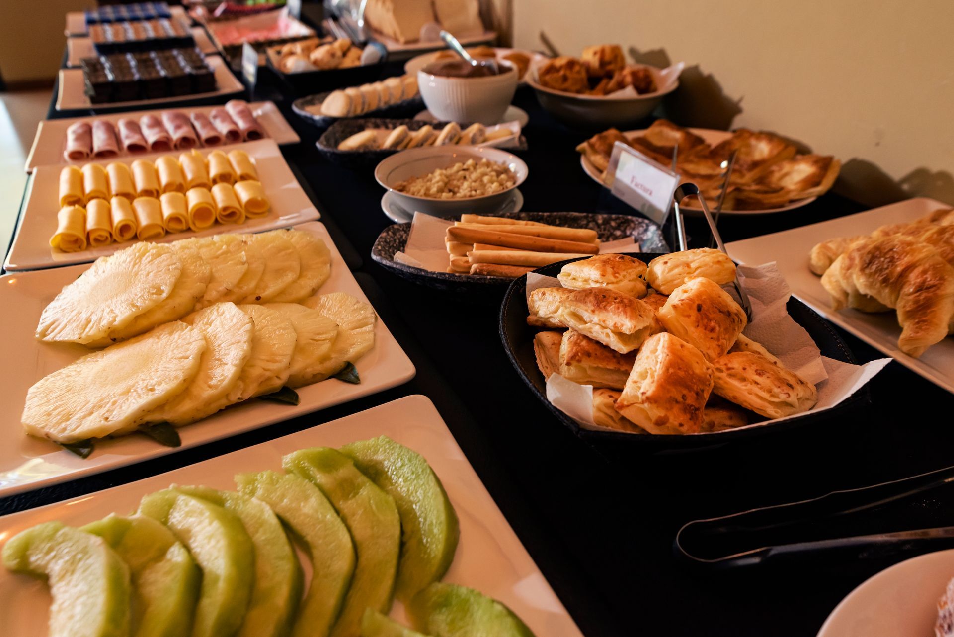 A buffet table with a variety of food on it