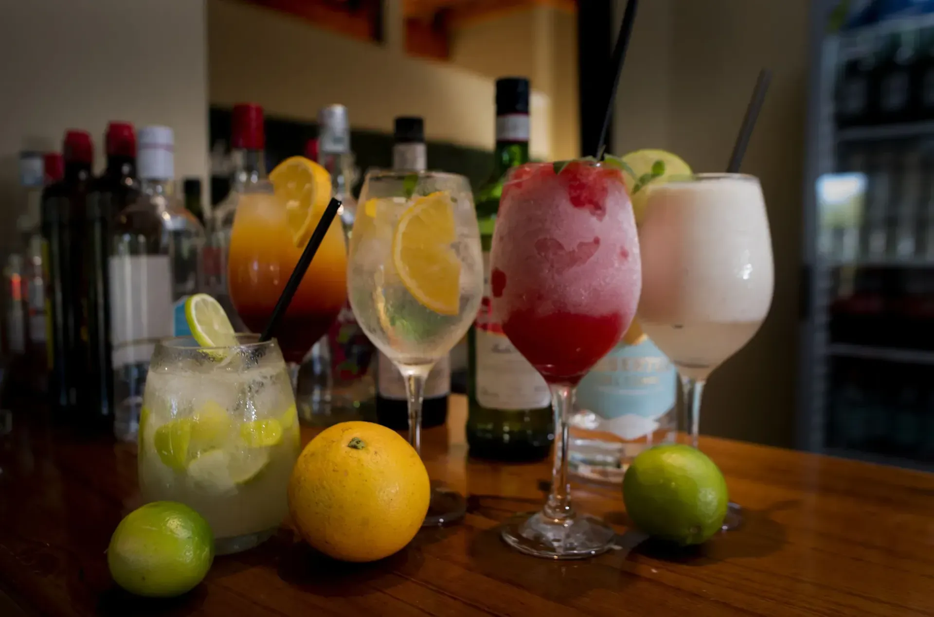 There are many different types of drinks on the table.