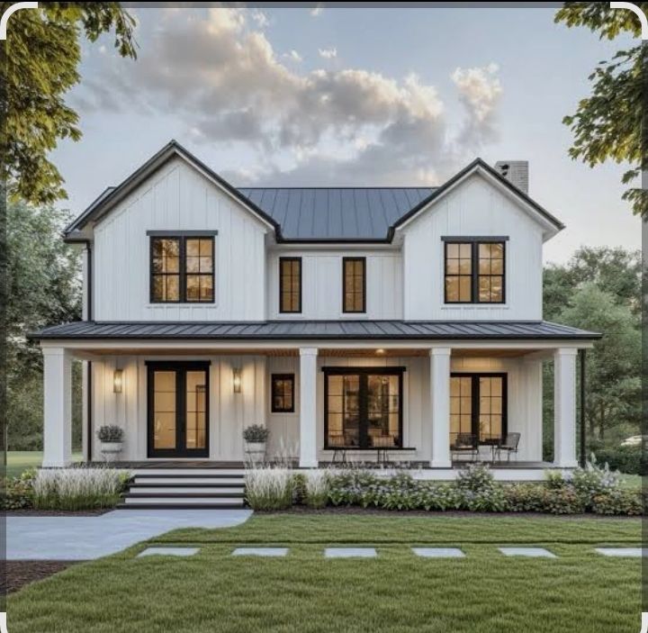 White farmhouse with black trim, a porch, and a green lawn.