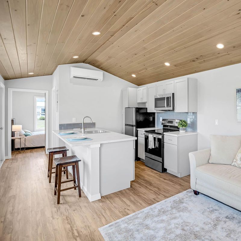 A large white house with three garage doors