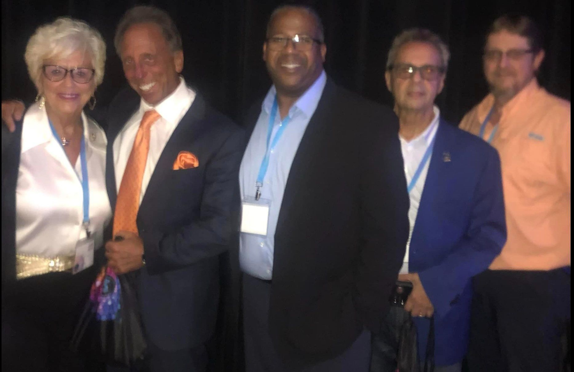 A group of men and women posing for a picture