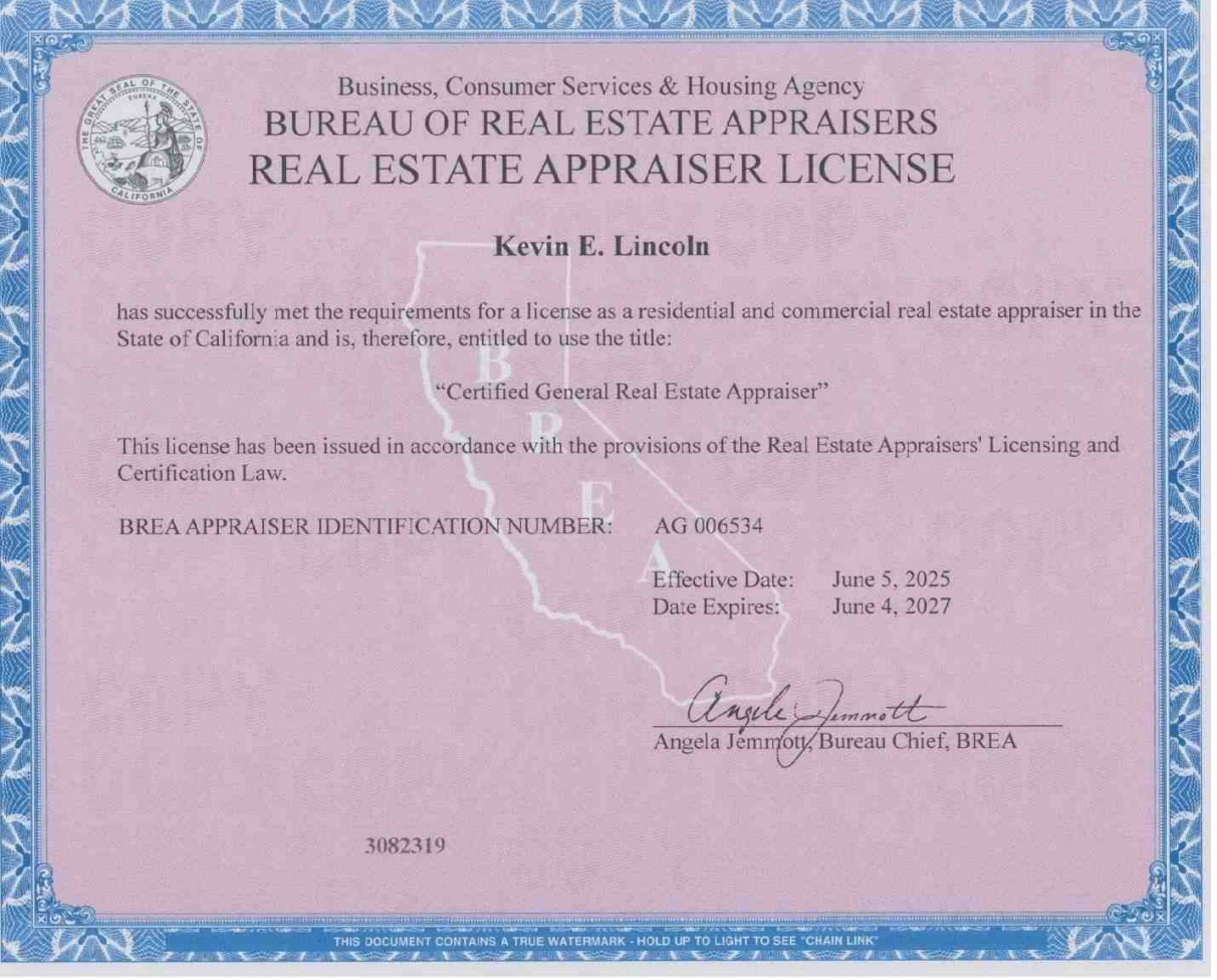 Laptop, calculator, documents, and glasses on a desk, possibly financial or tax-related work.