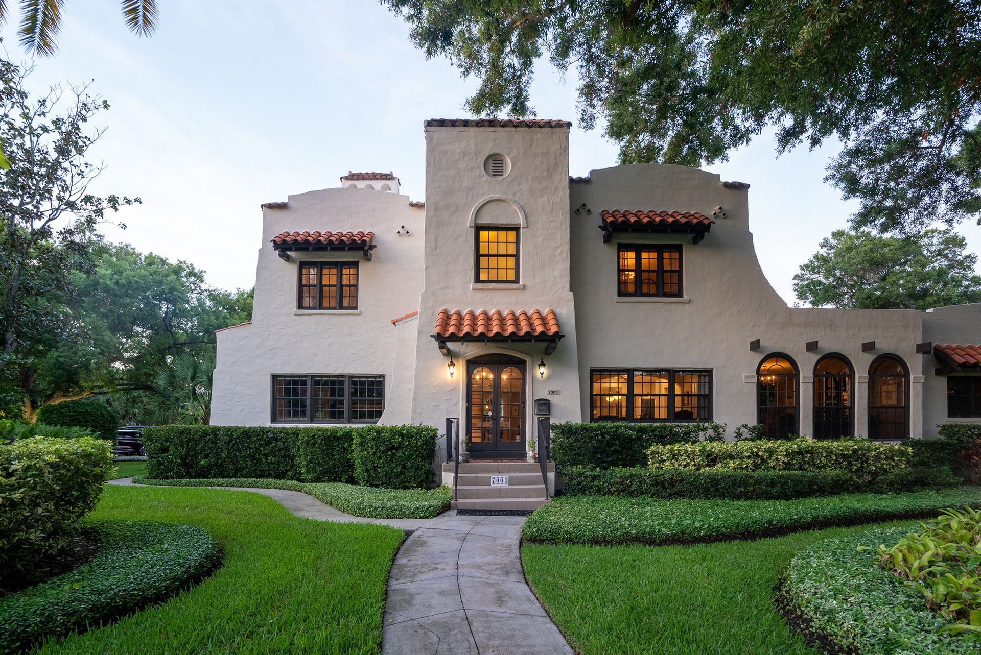 The inside of a moving truck filled with boxes and blankets.