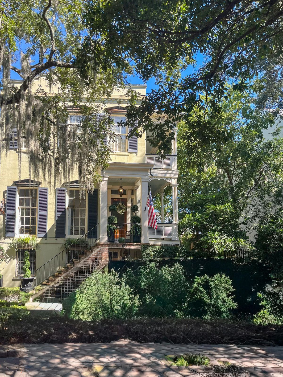 A white truck is parked in a parking lot next to a building.
