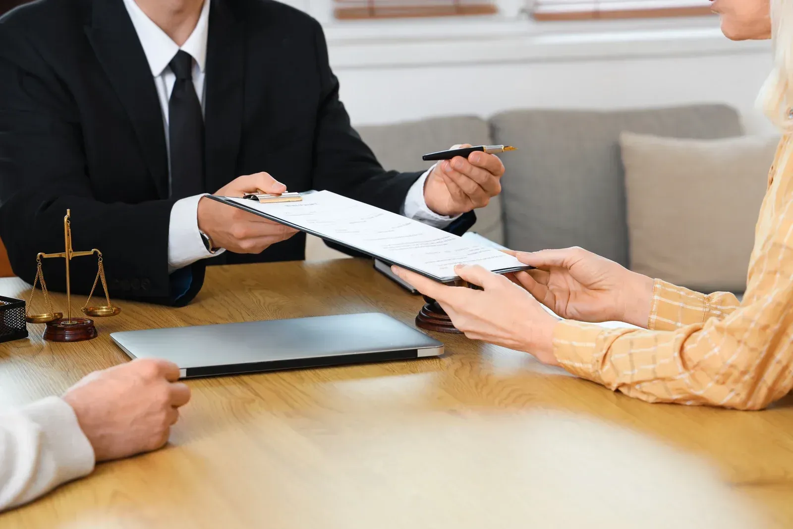 The inside of a moving truck filled with boxes and blankets.