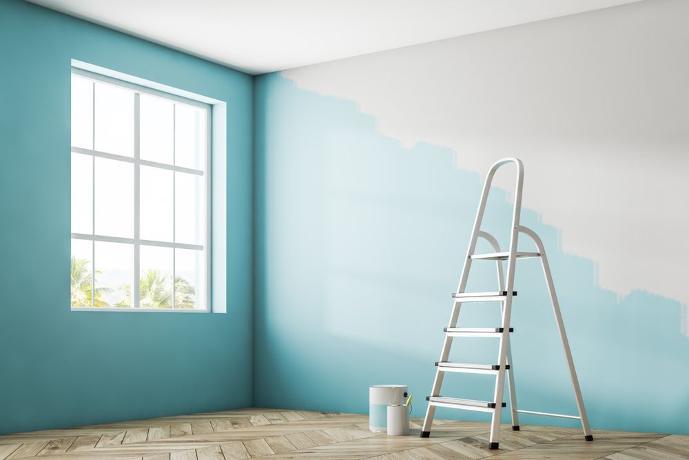 Empty Room With Blue Walls and a Ladder — Shaun Jarvis Quality Constructions in Medowie, NSW