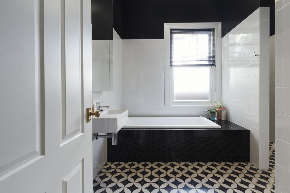Bathroom With a Bathtub , Sink and Window — Shaun Jarvis Quality Constructions in Medowie, NSW