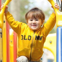 Little boy with yellow jacket - Childcare in Bayville, NJ