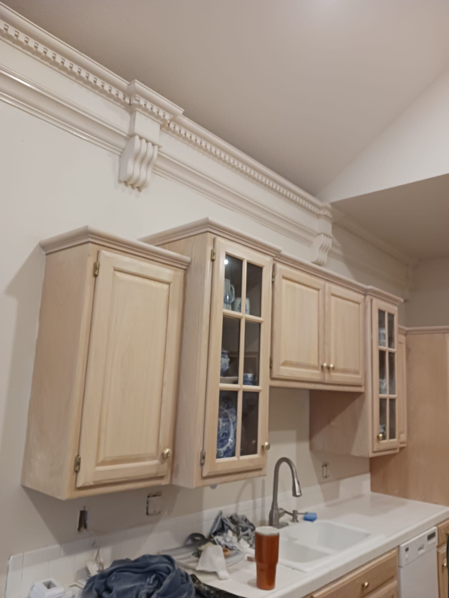 A kitchen with lots of cabinets and a sink