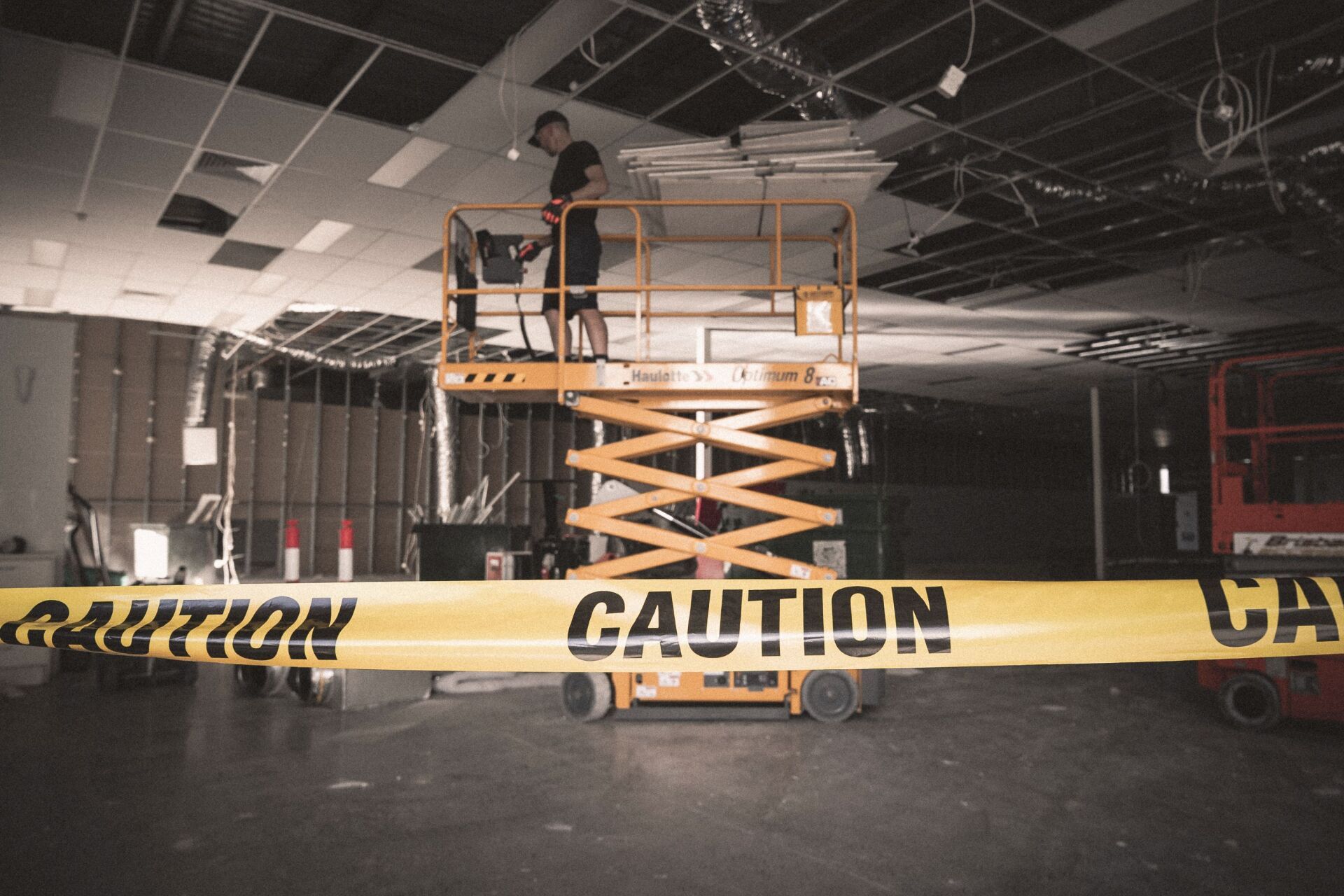 Man Removing Ceiling Panel — Demolition Services In Gold Coast, QLD