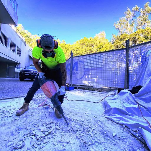 Man Cutting Metal Bars — Demolition Services In Baringa, QLD