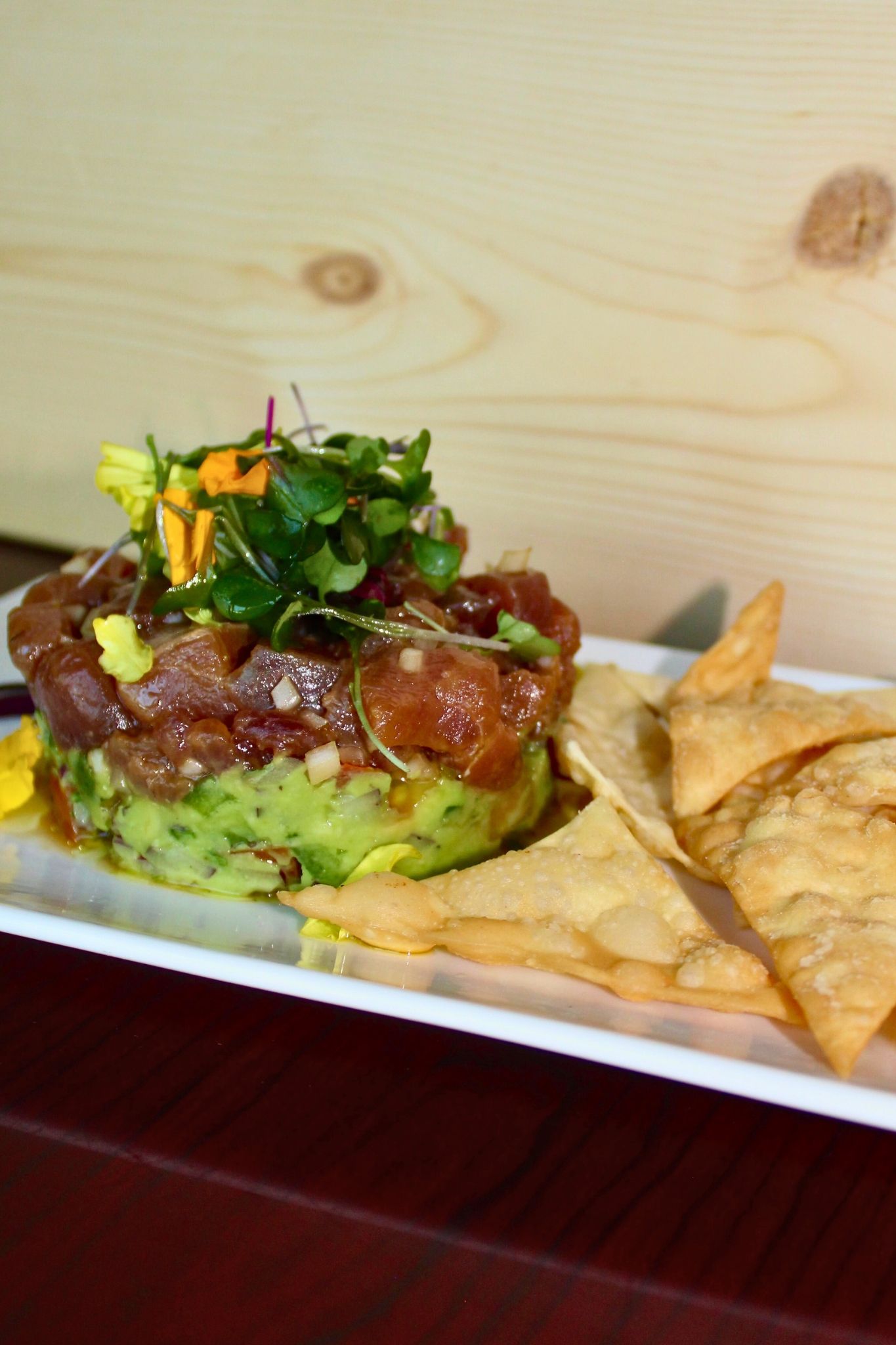 Ahi Tuna Napoleon
Seared ahi tuna layered with creamy guacamole for a fresh, vibrant bite.