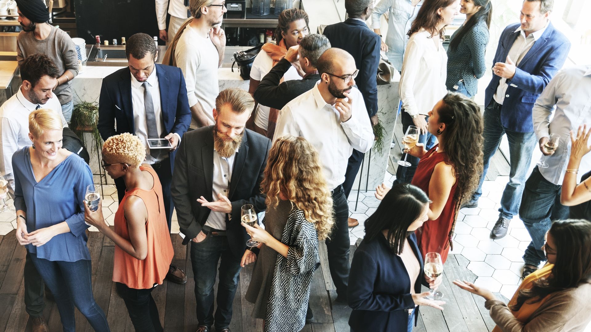 a group of people are putting their hands together in a circle