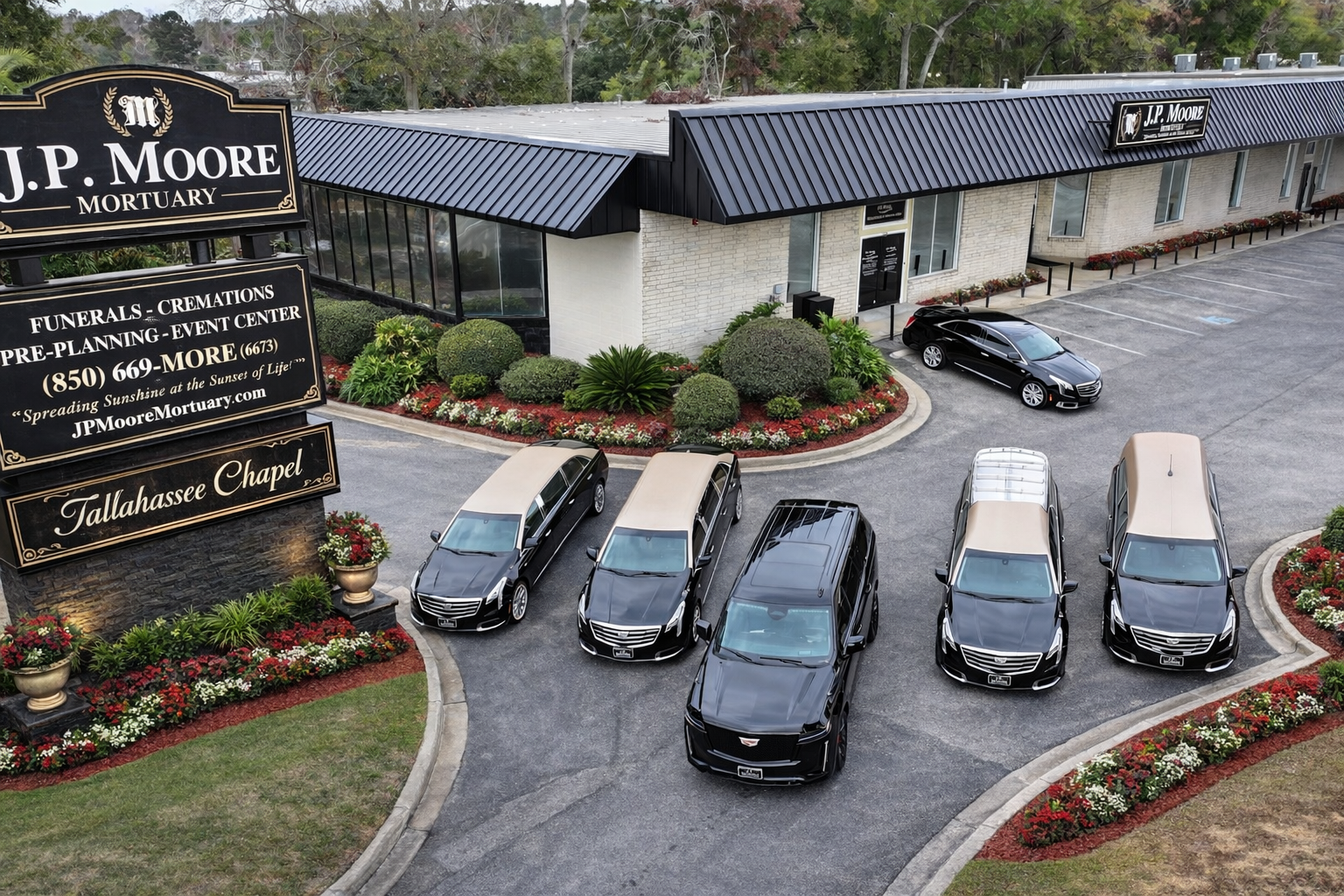 A large office building with a lot of windows on a sunny day.