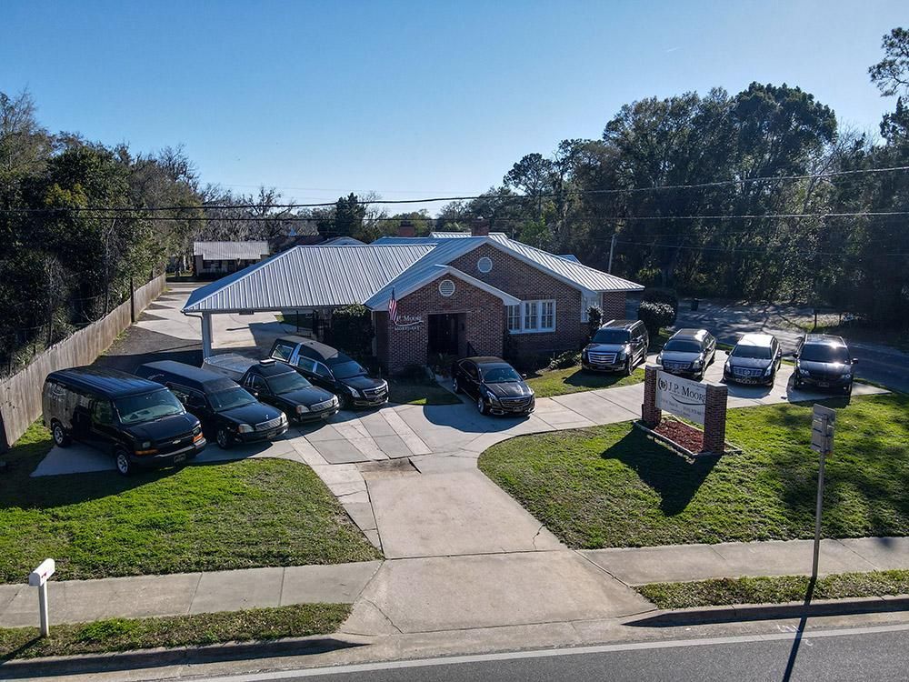 A large office building with a lot of windows on a sunny day.