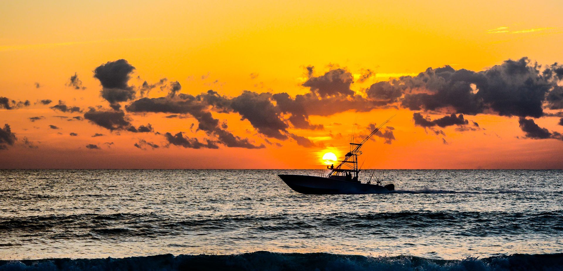 A large office building with a lot of windows on a sunny day.