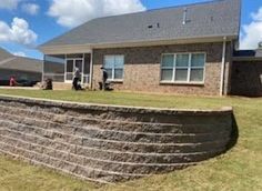 A pergola with a table and chairs underneath it