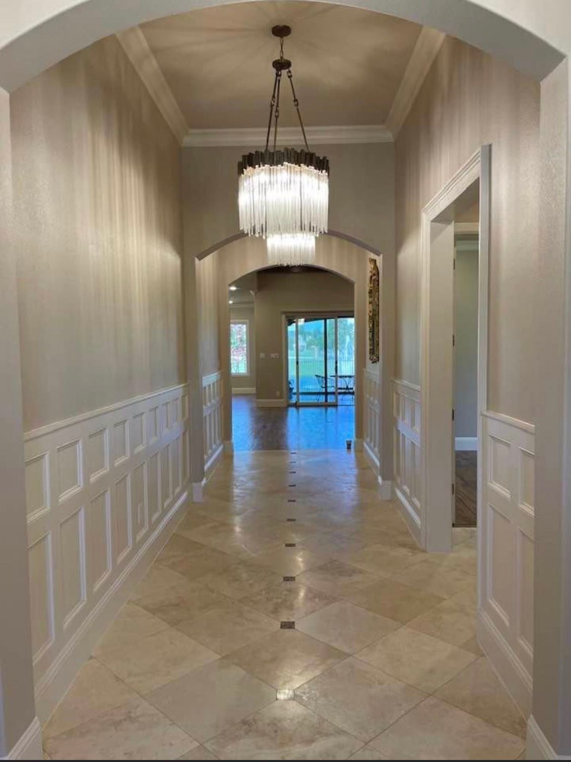 Painter Takes The Color With Paint Roller From The Bucket - Gainesville, TX - Morris Painting & Renovation