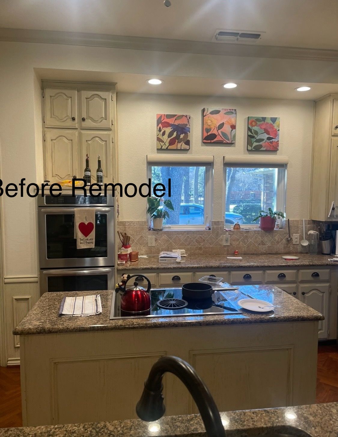 A Kitchen with White Cabinets and Granite Counter Tops Before a Remodel.