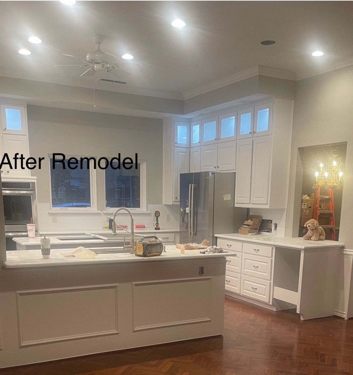 A Kitchen with White Cabinets and Stainless Steel Appliances After a Remodel