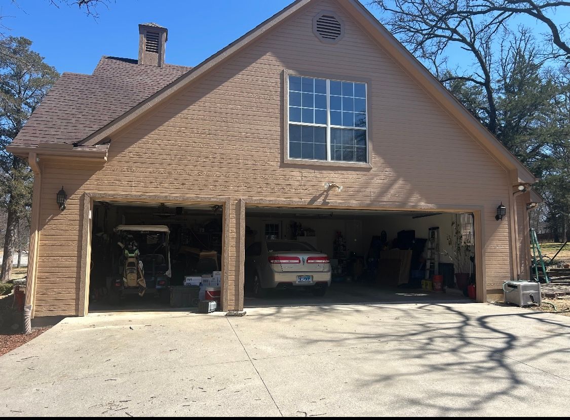 A car is parked in the garage of a house