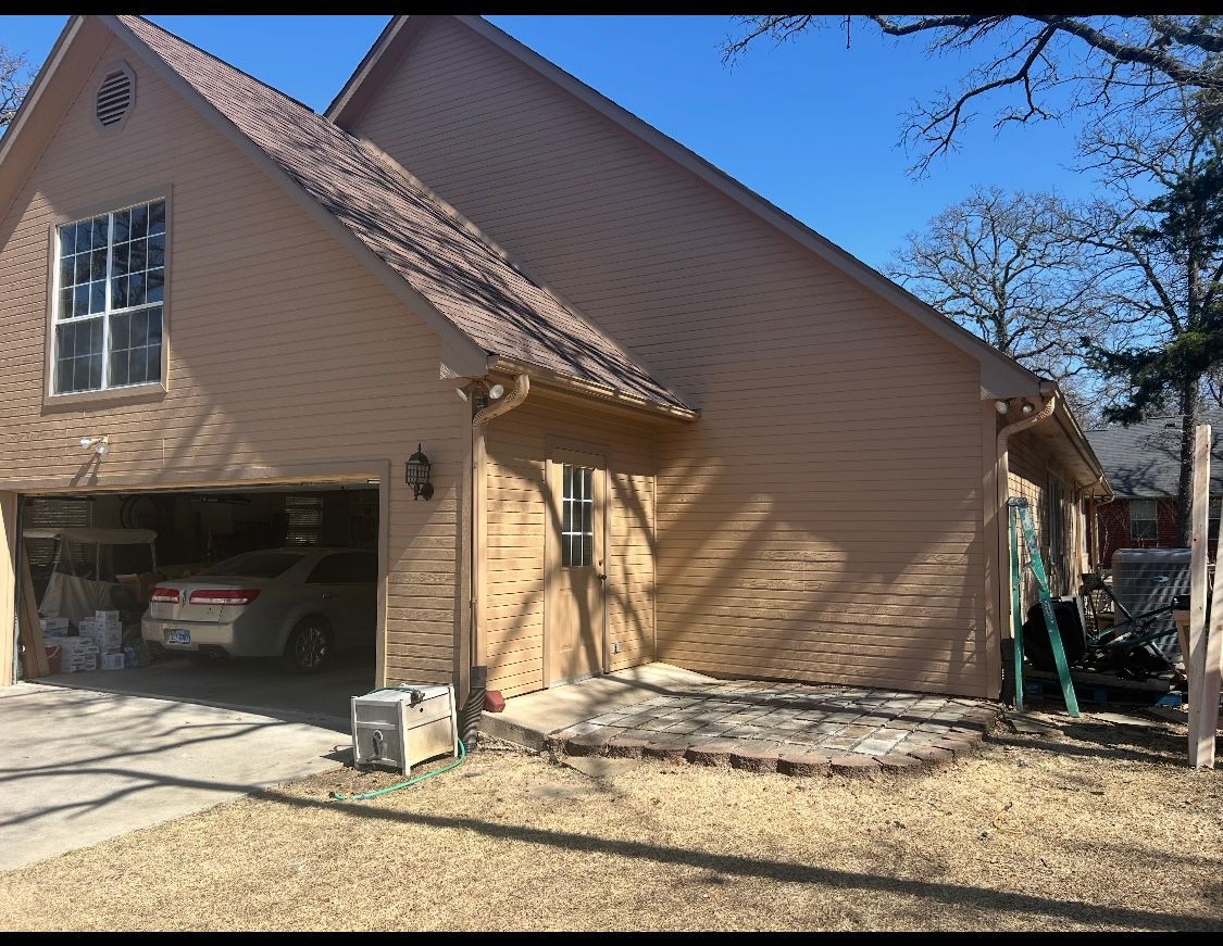 A car is parked in the garage of a house