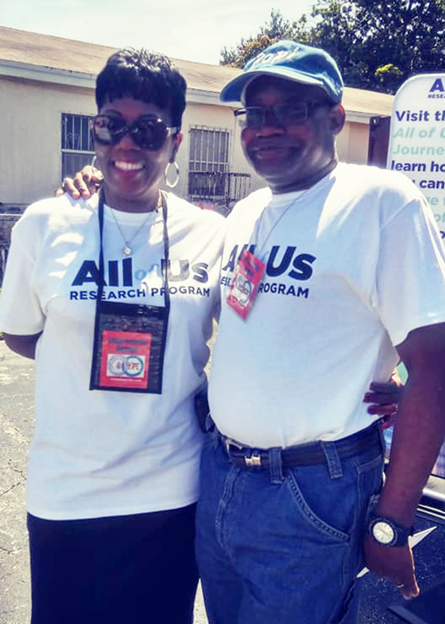 A man and a woman are posing for a picture while wearing all us shirts