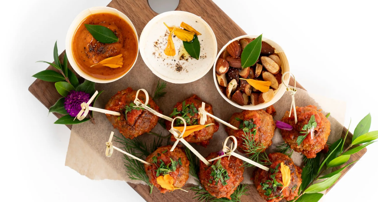 There are many different types of food on the cutting board.