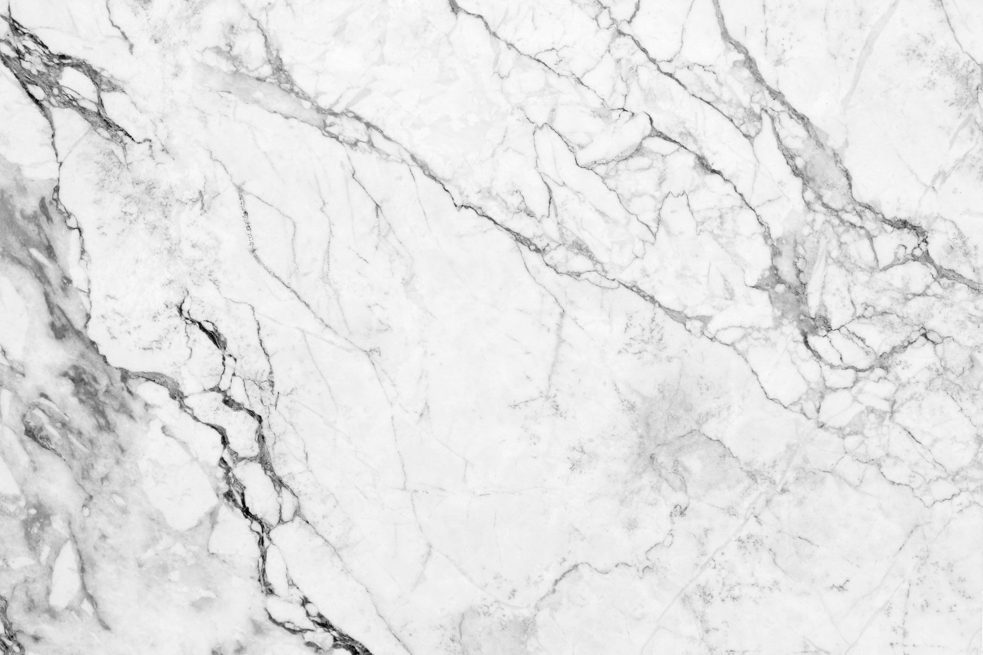 White marble surface with gray veining and a polished stone texture