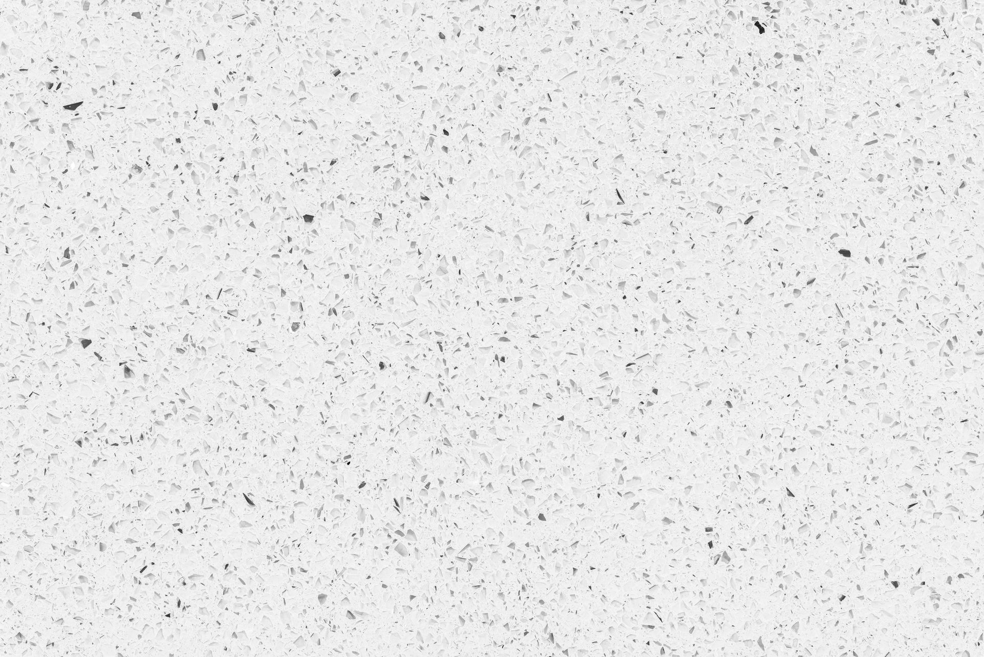 Light gray speckled texture with scattered black flecks