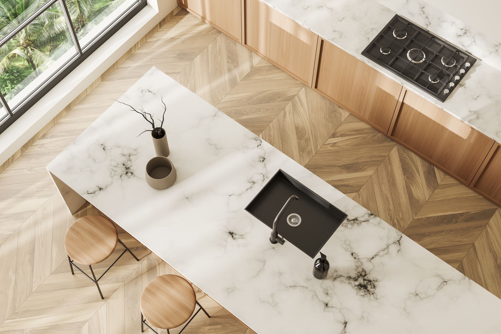 Modern kitchen with a marble island, wood floors, black sink, and built-in cooktop by large windows
