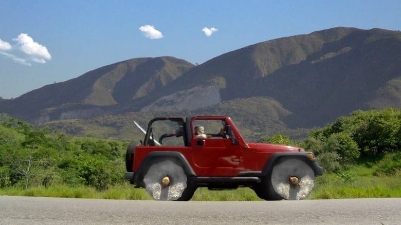 Um jipe ​​vermelho está dirigindo por uma estrada com montanhas ao fundo