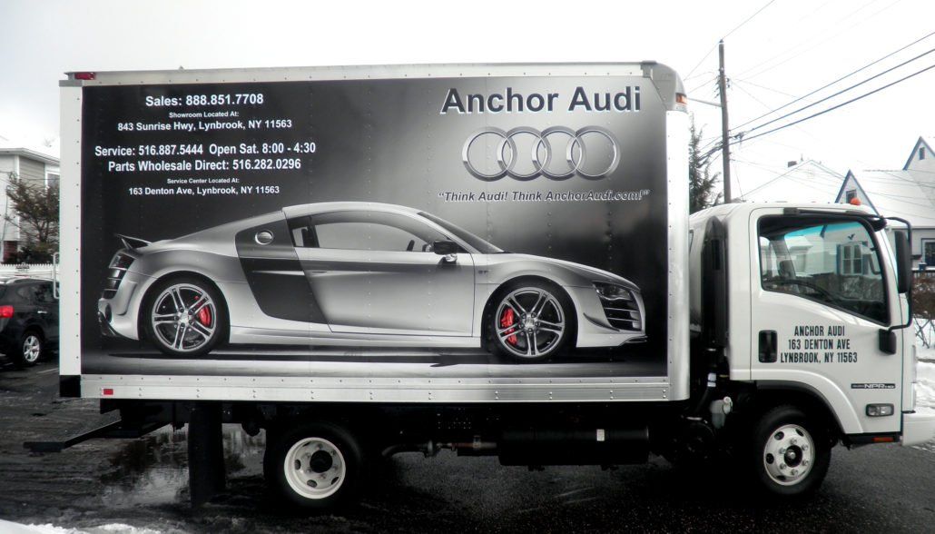 An audi truck is parked on the side of the road