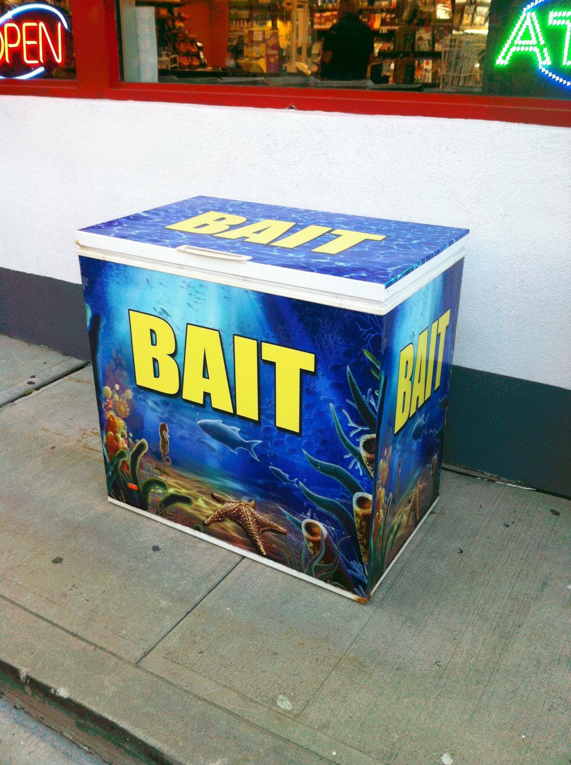 A freezer with the word bait on it