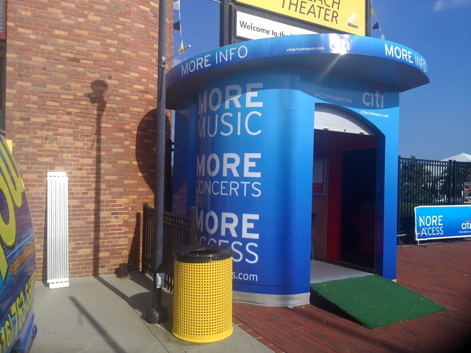 A blue building that says more music more concerts more access