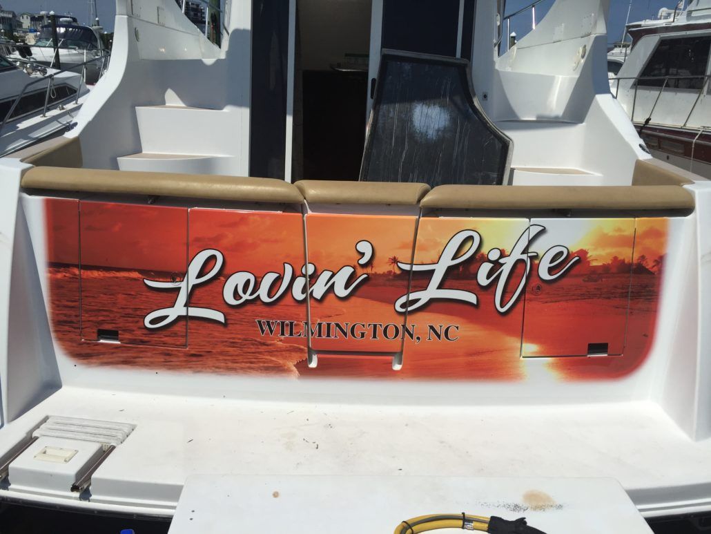 The back of a boat that says lovin ' life