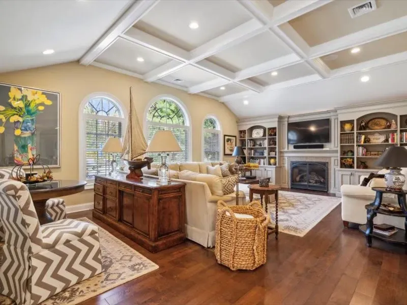 A living room filled with furniture and a fireplace.