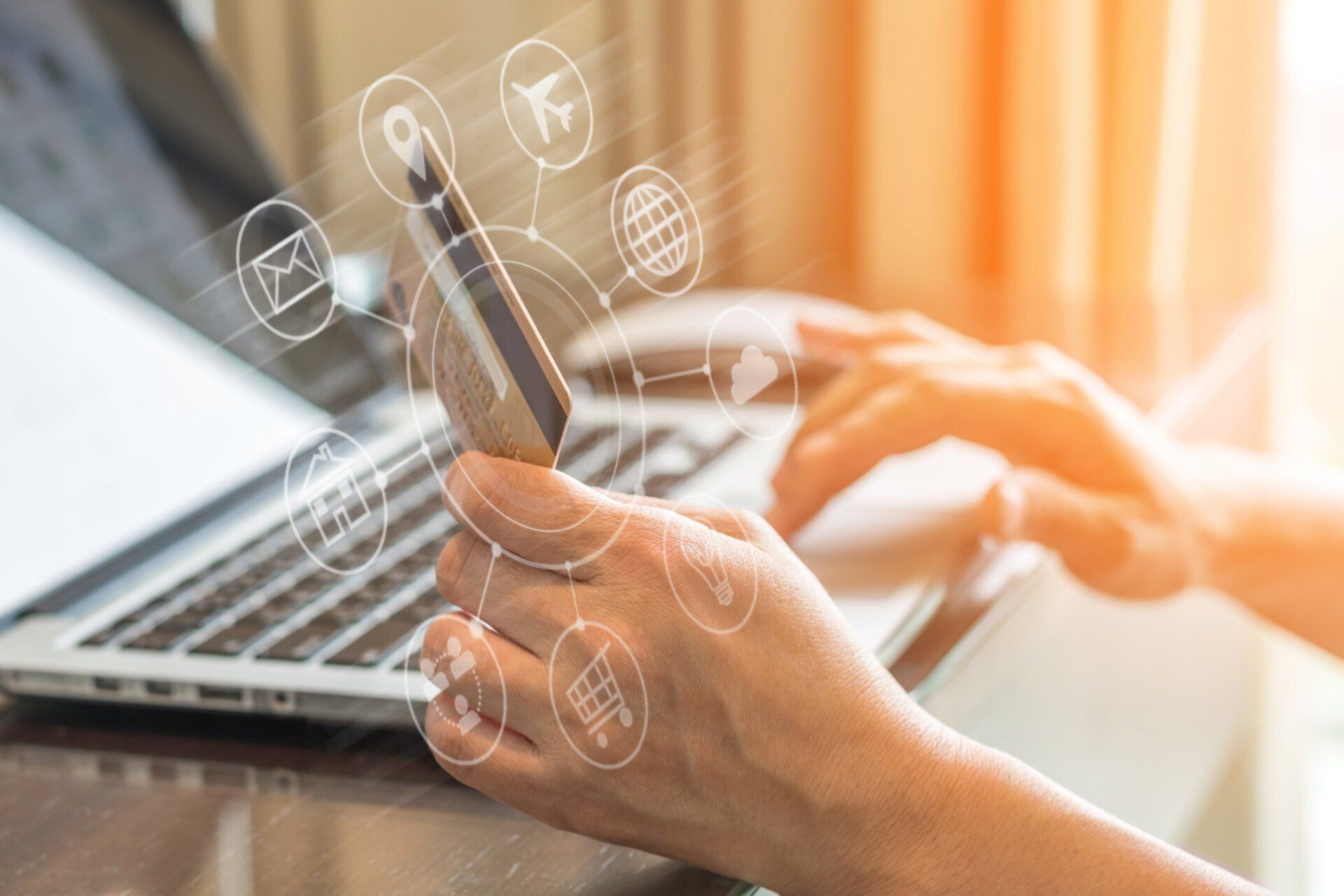 Person using a smartphone with floating digital marketing and communication icons