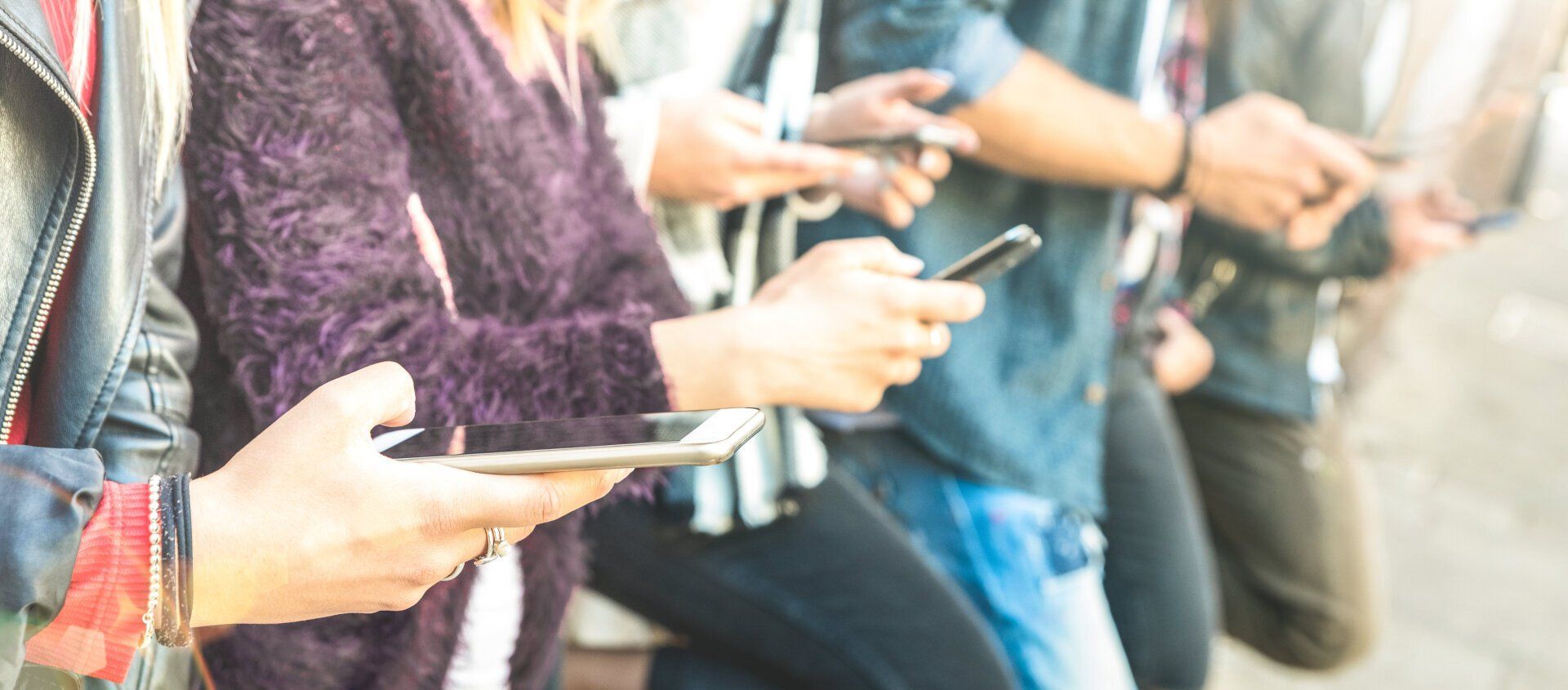 Social media team managing digital content across multiple devices